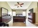 Spacious main bedroom features a ceiling fan, neutral paint, two windows, and dark furniture at 609 Tysons Forest Dr, Rock Hill, SC 29732