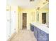 Bathroom featuring walk-in shower, double vanity, and walk-in closet at 6123 Glen Manor Dr, Charlotte, NC 28269