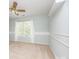 Light-filled bedroom with neutral carpet, wainscoting, and large window at 6123 Glen Manor Dr, Charlotte, NC 28269