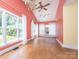 Sunlit bonus room with high ceilings, hardwood floors, and multiple windows at 6123 Glen Manor Dr, Charlotte, NC 28269