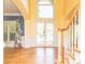 Welcoming foyer with hardwood floors, staircase, and bright natural light at 6123 Glen Manor Dr, Charlotte, NC 28269
