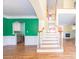 Inviting entryway with hardwood floors, staircase, and bright, colorful accents at 6123 Glen Manor Dr, Charlotte, NC 28269