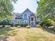 Charming home exterior with lush landscaping and a welcoming entrance at 6123 Glen Manor Dr, Charlotte, NC 28269
