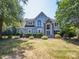 Lush landscaping frames the front exterior of this beautiful home at 6123 Glen Manor Dr, Charlotte, NC 28269