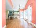 A gourmet kitchen is displayed with an island, stainless hood vent, and a decorative chandelier overhead at 6123 Glen Manor Dr, Charlotte, NC 28269