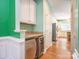 Wet bar with beverage cooler and granite countertop near the kitchen at 6123 Glen Manor Dr, Charlotte, NC 28269