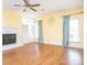 Cozy living room featuring a fireplace, built-ins, and ceiling fan at 6123 Glen Manor Dr, Charlotte, NC 28269
