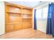 Office featuring built-in wooden shelves and hardwood flooring at 6123 Glen Manor Dr, Charlotte, NC 28269