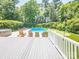 Relaxing pool area with lounge chairs, putting green, hot tub, and lush landscaping for outdoor enjoyment at 6123 Glen Manor Dr, Charlotte, NC 28269