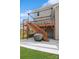 Backyard view showcasing a wooden deck and a patio with a grill at 620 Baneberry Bluff Ct, Rock Hill, SC 29732