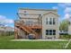 Backyard view showcasing a wooden deck and a patio with a grill at 620 Baneberry Bluff Ct, Rock Hill, SC 29732