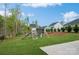 Wide backyard featuring a play set with slide, swing, and climbing frame at 620 Baneberry Bluff Ct, Rock Hill, SC 29732