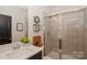 A clean bathroom with a walk-in shower and a decorative wreath at 620 Baneberry Bluff Ct, Rock Hill, SC 29732