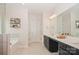 Bright bathroom with dual sinks, a large mirror, and a stylish vanity, enhancing the home's appeal at 620 Baneberry Bluff Ct, Rock Hill, SC 29732