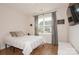 Neutral bedroom with a comfortable bed, natural light, and minimalist decor at 620 Baneberry Bluff Ct, Rock Hill, SC 29732