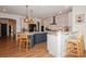 Open kitchen with two-tone cabinets, modern appliances, breakfast bar, and pendant lighting at 620 Baneberry Bluff Ct, Rock Hill, SC 29732