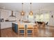 Open kitchen with a large island, modern appliances, and adjacent dining area at 620 Baneberry Bluff Ct, Rock Hill, SC 29732