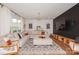 A spacious living room showcasing a large sectional sofa, modern rug, and dark accent wall at 620 Baneberry Bluff Ct, Rock Hill, SC 29732