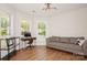 Bright living room with hardwood floors, large windows, and comfortable seating area at 620 Baneberry Bluff Ct, Rock Hill, SC 29732