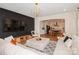 Open-concept living room with a large TV, plush seating, and view into the kitchen at 620 Baneberry Bluff Ct, Rock Hill, SC 29732