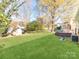 Large backyard featuring lush grass, shed, and patio furniture, great for outdoor living at 6310 Welford Rd, Charlotte, NC 28211