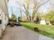 Expansive backyard with a patio, outdoor seating, and well-maintained lawn at 6310 Welford Rd, Charlotte, NC 28211