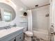 Bathroom featuring a modern vanity, decorative tile floor, and shower with tiled walls at 6310 Welford Rd, Charlotte, NC 28211