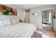 Bedroom showcasing neutral walls, wood floors, and mirrored closet doors at 6310 Welford Rd, Charlotte, NC 28211