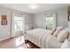 Bright bedroom features wood floors, neutral walls, and a crib for a Bedroom space at 6310 Welford Rd, Charlotte, NC 28211
