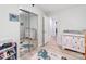 Bright room with a mirror closet, white dressers and decoratively carpeted floor at 6310 Welford Rd, Charlotte, NC 28211