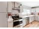Well-equipped kitchen with sleek countertops, stainless steel appliances, and stylish cabinetry at 6310 Welford Rd, Charlotte, NC 28211