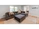 Living room with a large sectional sofa, natural light, and easy access to the dining room at 6310 Welford Rd, Charlotte, NC 28211