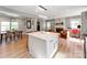 Open-concept living area with dining space, fireplace, and a cozy sitting area at 6310 Welford Rd, Charlotte, NC 28211