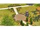 Aerial shot of a community fire pit with seating, surrounded by lush greenery and walking paths at 637 Amber Meadows Way, Fort Mill, SC 29708