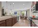 Open-concept kitchen with stainless appliances, granite counters, and a dining area at 637 Amber Meadows Way, Fort Mill, SC 29708