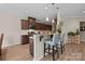 Well-equipped kitchen with a breakfast bar, pendant lighting, and modern appliances at 637 Amber Meadows Way, Fort Mill, SC 29708