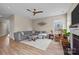 Comfortable living room with a ceiling fan, large gray couch, and hardwood floors at 637 Amber Meadows Way, Fort Mill, SC 29708