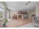Bright, open living space featuring wood floors, a dining area, and a kitchen with a breakfast bar at 637 Amber Meadows Way, Fort Mill, SC 29708