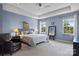 Serene main bedroom featuring a tray ceiling, plush carpet, and two windows for natural light at 637 Amber Meadows Way, Fort Mill, SC 29708