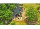 Aerial shot of a playground with green and beige features, nestled among mature trees and lush landscaping at 637 Amber Meadows Way, Fort Mill, SC 29708