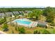 Aerial view of a sparkling community pool surrounded by lounge chairs and manicured landscaping in a residential neighborhood at 637 Amber Meadows Way, Fort Mill, SC 29708