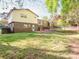 Home's backyard featuring well-maintained lawn, patio and mature trees at 7024 Rockledge Dr, Charlotte, NC 28210