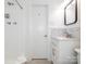 Updated bathroom with tiled shower, vanity, modern fixtures, and lots of light at 7024 Rockledge Dr, Charlotte, NC 28210