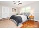 Bedroom with ample natural light, ceiling fan, and hardwood floors at 7024 Rockledge Dr, Charlotte, NC 28210