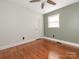 Bedroom featuring hardwood floors, a ceiling fan, and natural lighting at 7024 Rockledge Dr, Charlotte, NC 28210