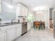 Charming dining area with tile floors and ample natural light at 7024 Rockledge Dr, Charlotte, NC 28210