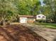 Split-level home featuring a large driveway and brick accents at 7024 Rockledge Dr, Charlotte, NC 28210