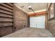 Spacious garage with brick walls and shelving at 7024 Rockledge Dr, Charlotte, NC 28210