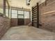 Garage featuring concrete floor and brick walls at 7024 Rockledge Dr, Charlotte, NC 28210