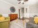 Inviting living room with a neutral color palette and staircase view at 7024 Rockledge Dr, Charlotte, NC 28210